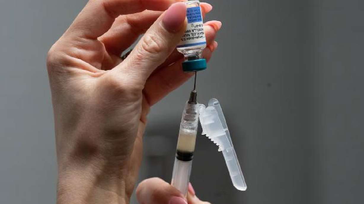 Lauren Ellenburg, a nurse, prepares a combination measles, mumps and rubella vaccine for a patient at Tiger Pediatrics in Easley, S.C., March 17.