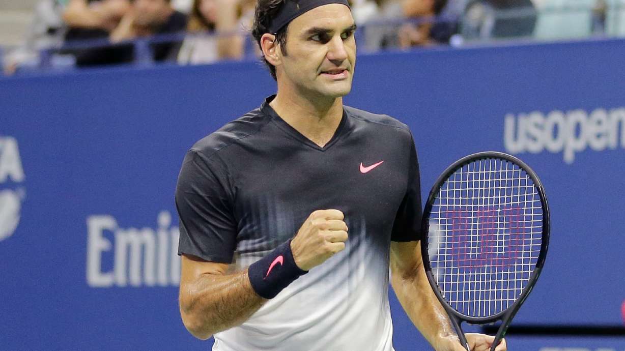 FILE - Roger Federer, of Switzerland, clenches his fist after wining a point against Feliciano Lopez, of Spain, during the U.S. Open tennis tournament in New York, Sept. 2, 2017.