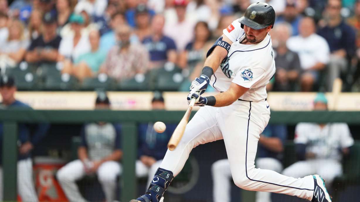 Seattle Mariners' Cal Raleigh hits a solo home run during the second inning of a baseball game against the Philadelphia Phillies, Tuesday, Aug. 25, 2026, in Seattle.