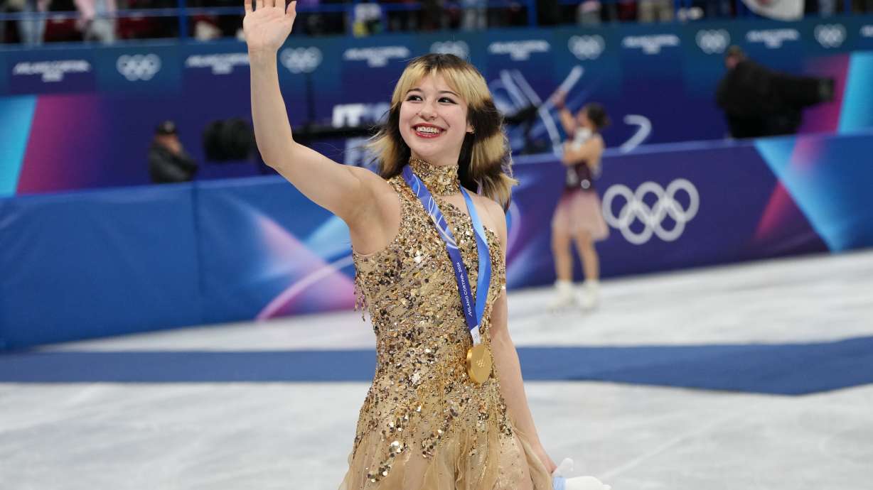 FILE - Gold medalist Alysa Liu of the United States displays her medal after competing in the women's free skate program in figure skating at the 2026 Winter Olympics, in Milan, Italy, Thursday, Feb. 19, 2026.