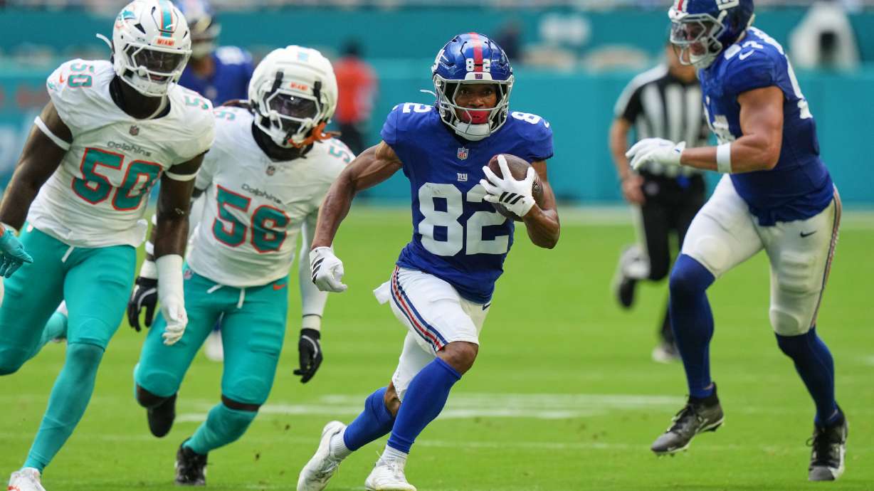 New York Giants wide receiver Calvin Austin III (82) runs the ball during the first half of a preseason NFL football game against the Miami Dolphins, Saturday, Aug. 22, 2026, in Miami Gardens, Fla.