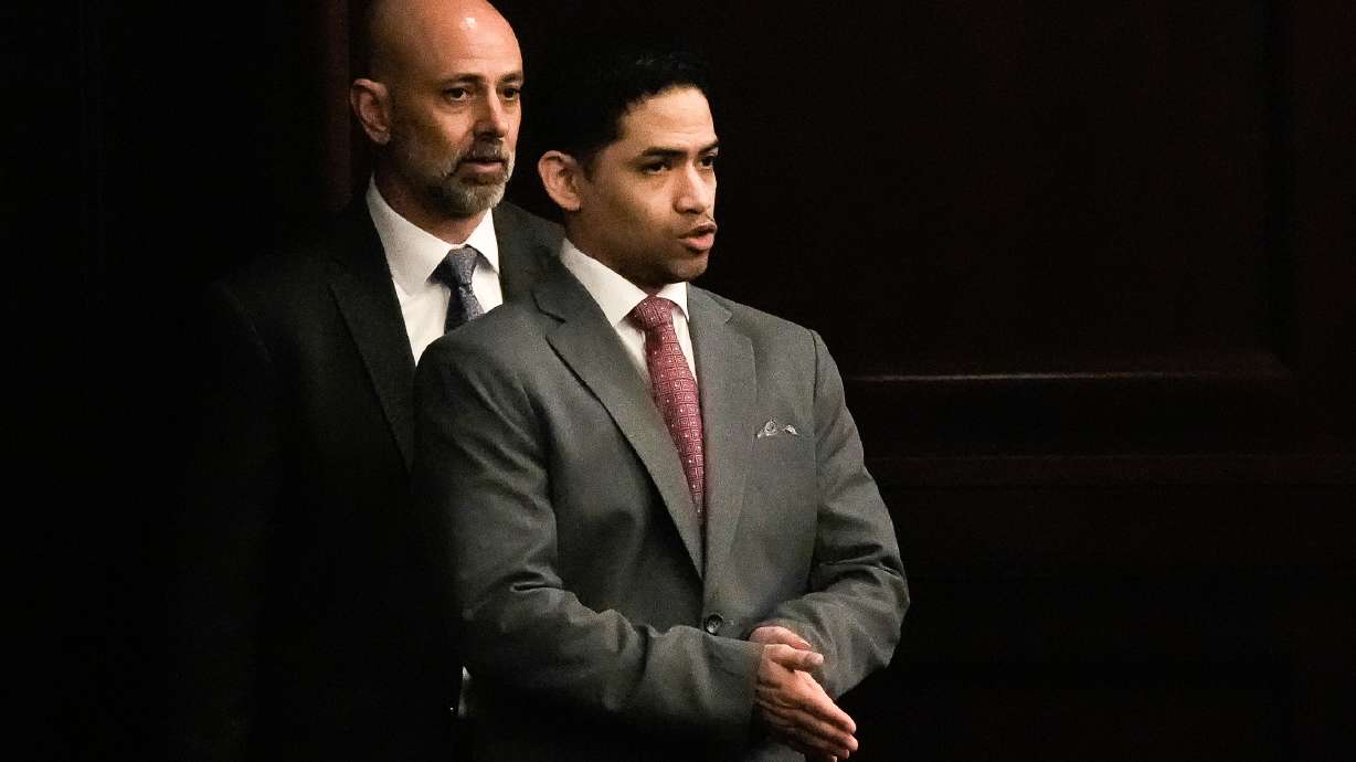 Defense Attorney James Hill, left walks in his client, defendant Mario Fernandez Saldana, during his trial on Tuesday, Aug. 25, 2026 at the Duval Count Courthouse in Jacksonville, Fla. [Doug Engle/The Florida Times-Union via AP, Pool)