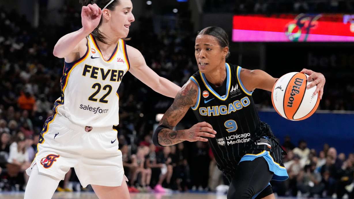 Chicago Sky guard Natasha Cloud, right, drives against Indiana Fever guard Caitlin Clark during the second half of a WNBA basketball game Sunday, Aug. 23, 2026, in Chicago.