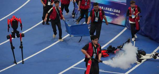 A robot sprinter shatters a 100-meter record again as sparks fly at China's robot competition