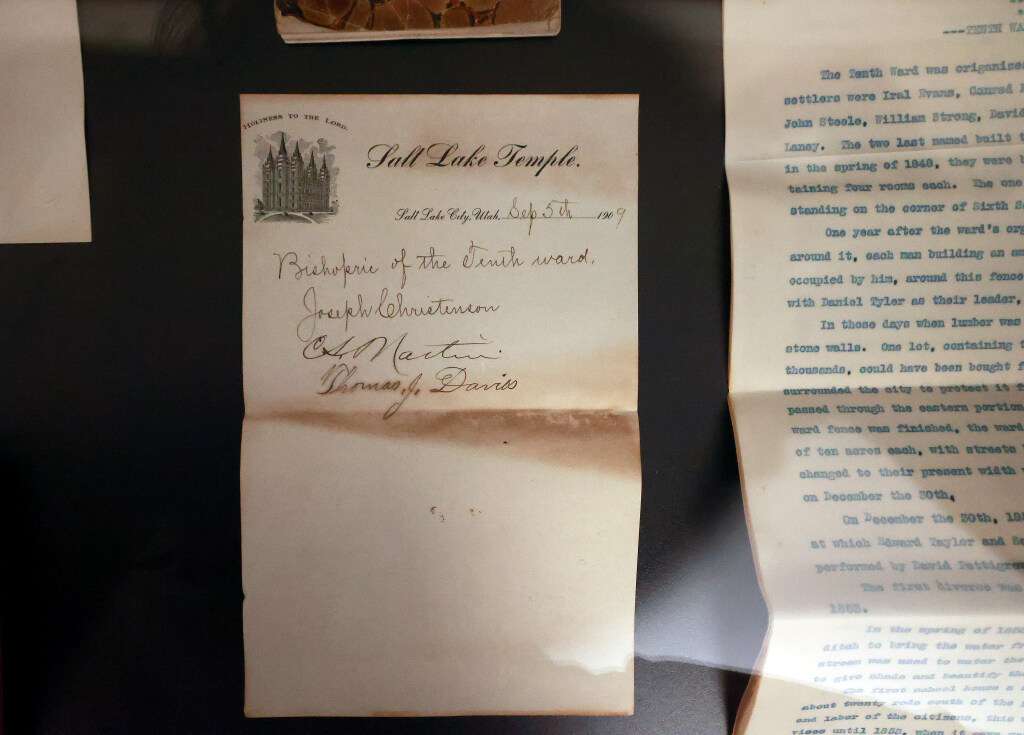 Contents of a 1909 time capsule, found in the cornerstone of a historic building of The Church of Jesus Christ of Latter-day Saints, are on display at the Tenth Ward Square in Salt Lake City on Tuesday.