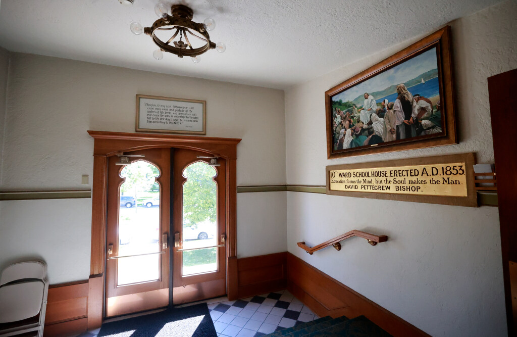 An entrance to The Church of Jesus Christ of Latter-day Saints Tenth Ward Square chapel, built in 1909, in Salt Lake City, on Tuesday. A sign commemorates the original schoolhouse, built in 1853.