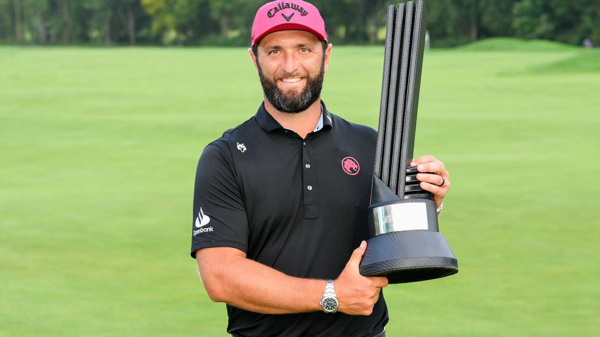 LIV Golf season-long champion captain Jon Rahm, of Legion XIII, poses with the trophy after the final round of LIV Golf Indianapolis, Sunday, Aug. 23, 2026, in Westfield, Ind.