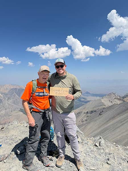 Noel Johnson, left, and Zach Campbell at the top of Mount Borah.