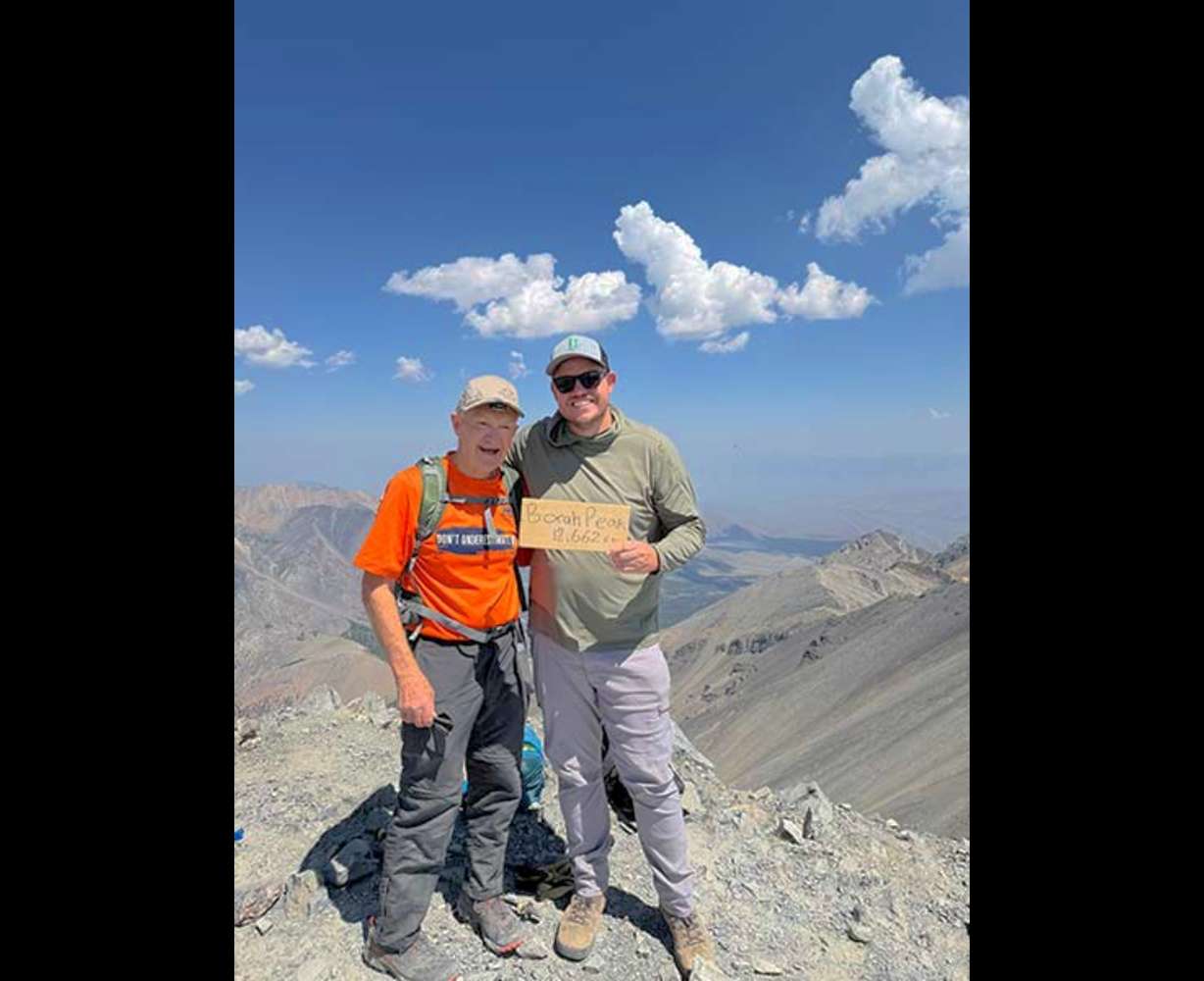 Noel Johnson, left, and Zach Campbell at the top of Mount Borah.
