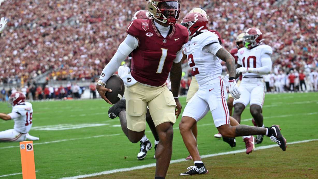 FILE - Florida State quarterback Tommy Castellanos (1) rushes for a touchdown against Alabama during the first half of an NCAA college football game, Saturday, Aug. 30, 2025, in Tallahassee, Fla.