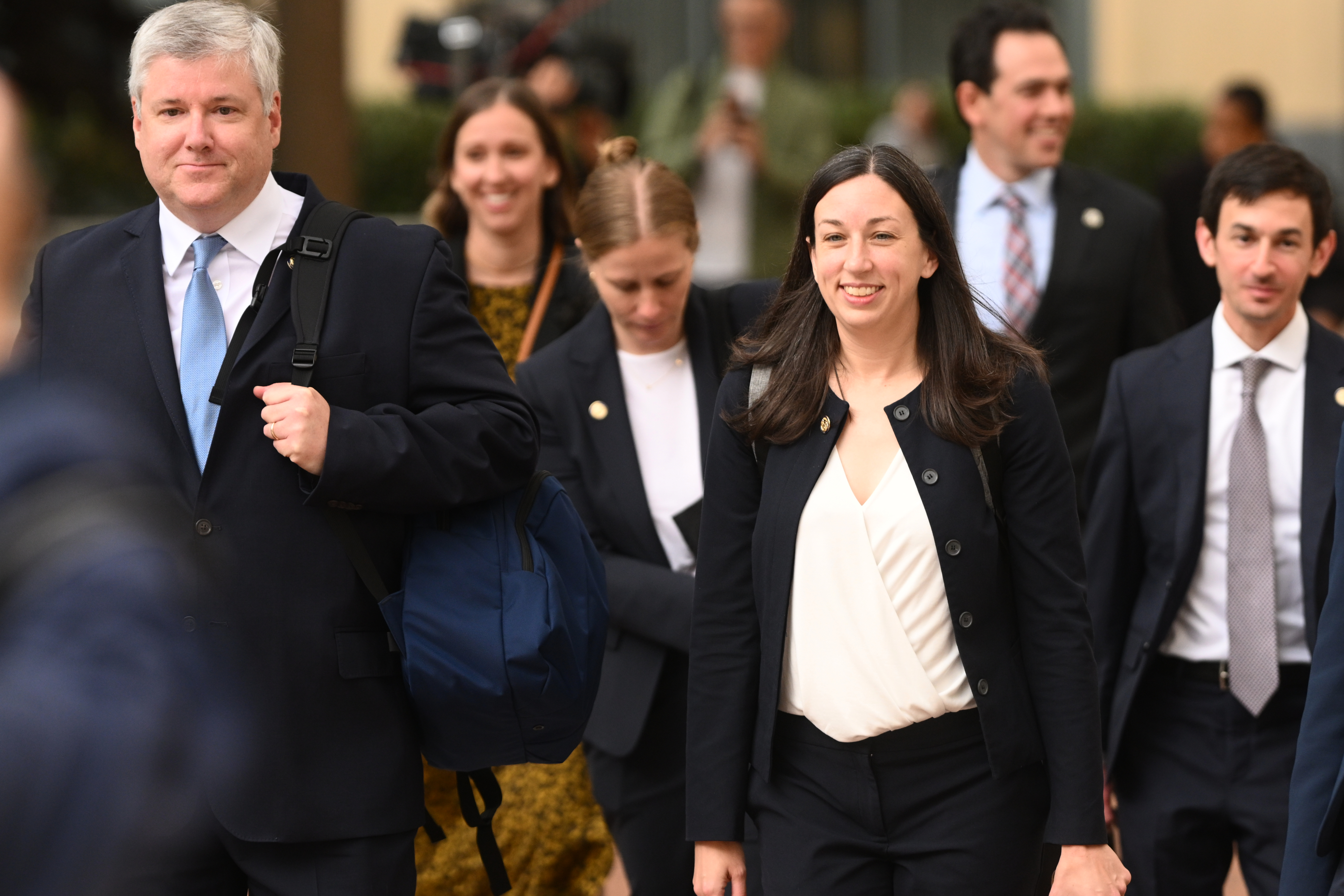 Nicklas Akers, California Senior Assistant Attorney General, left, and Deputy Attorney General Megan O'Neill exit court after tech giant Meta reached a settlement to end a landmark trial over teen social media addiction in Oakland, Calif., Wednesday.