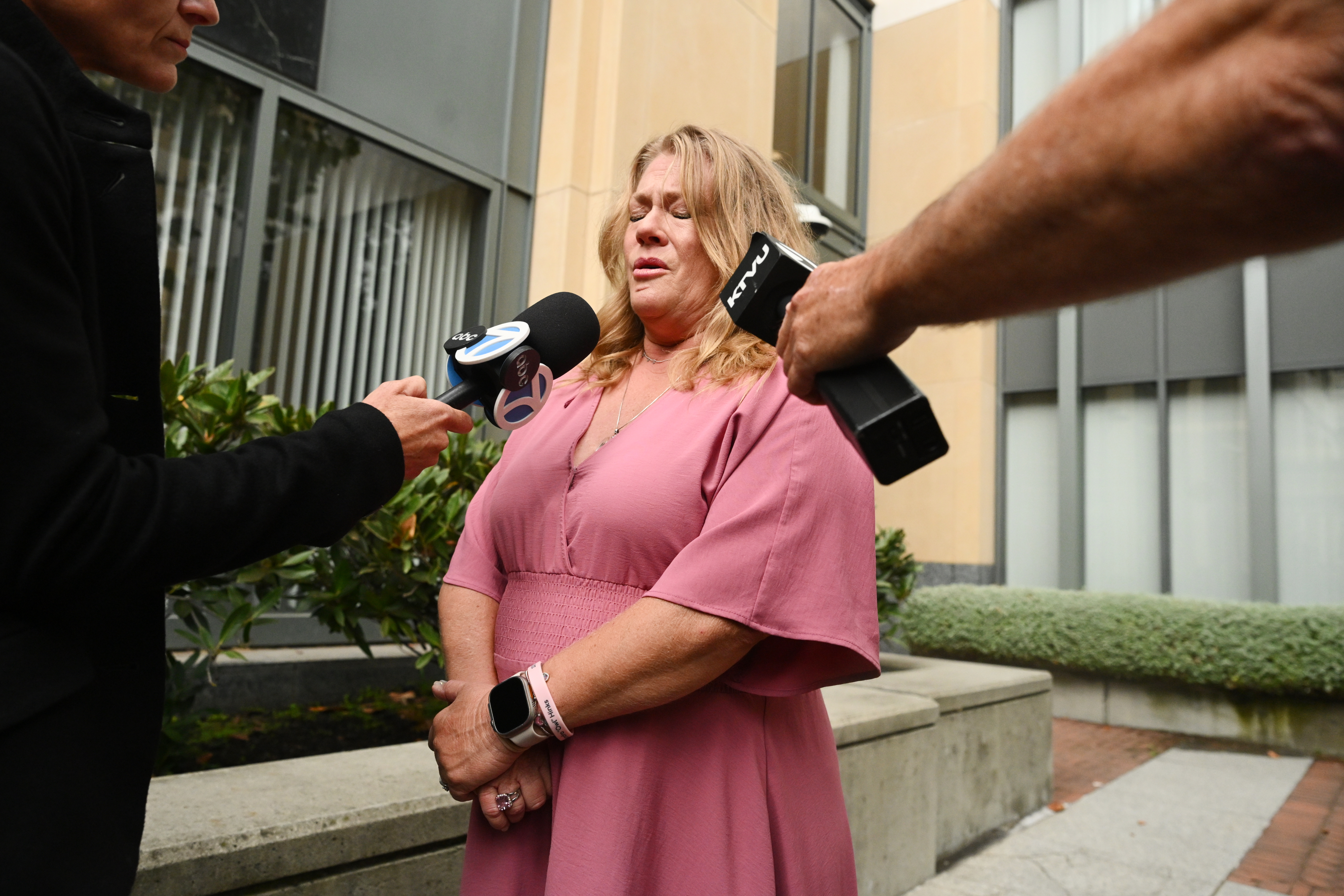 Victoria Hinks gets emotional after talking about her daughter with the media outside court after tech giant Meta reached a settlement to end a landmark trial over teen social media addiction on Wednesday, in Oakland, Calif.