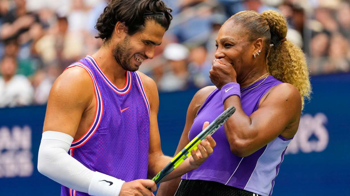 Carlos Alcaraz, of Spain, left, and Serena Williams, of the United States, talk on the court during a mixed doubles match at the U.S. Open tennis championships, Tuesday, Aug. 25, 2026, in New York.