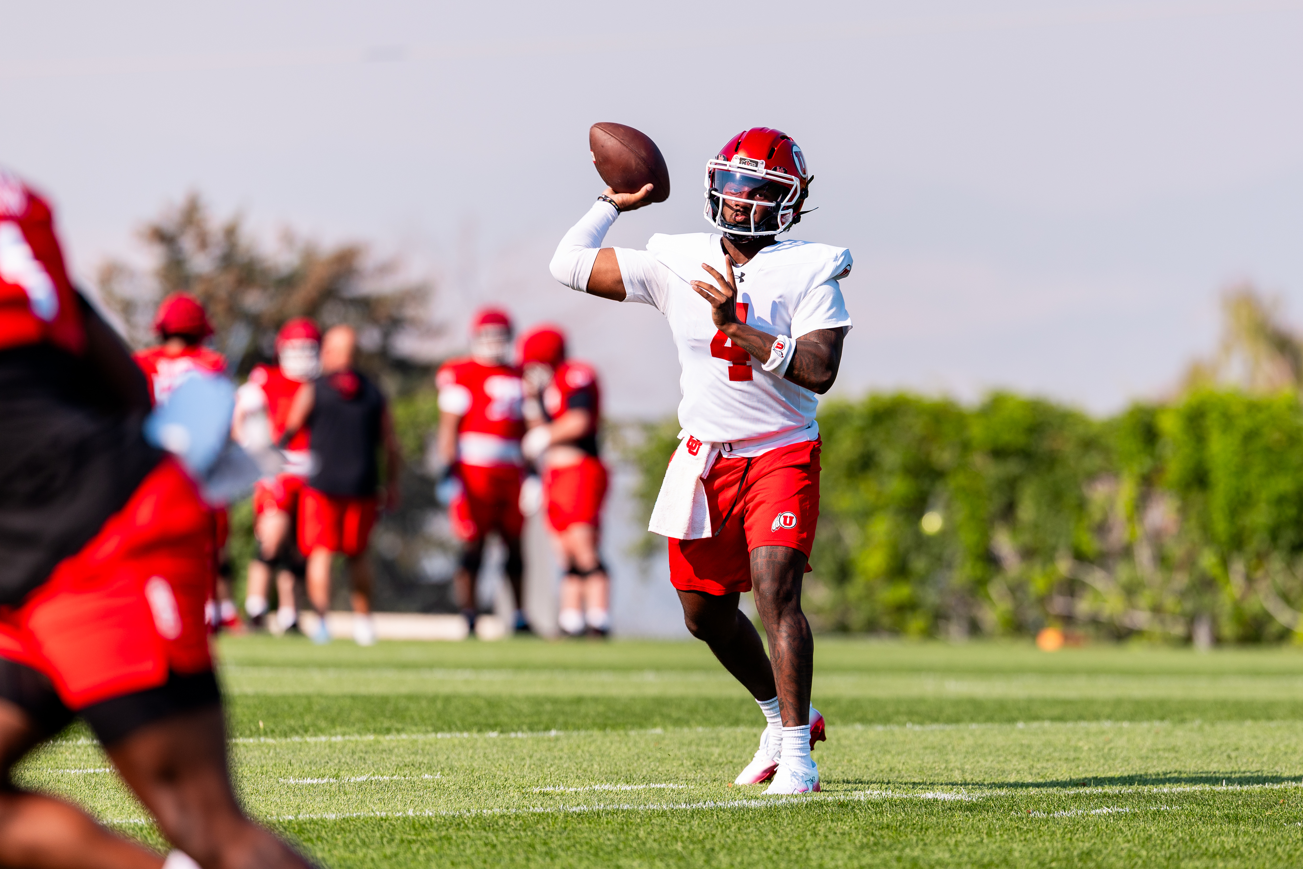 Utah quarterback Devon Dampier attempts a pass at practice at the Spence and Cleone Eccles Football Facility in Salt Lake City on Aug. 3, 2026.