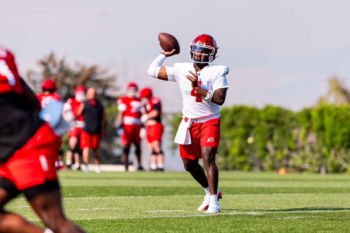 Utah quarterback Devon Dampier attempts a pass at practice at the Spence and Cleone Eccles Football Facility in Salt Lake City on Aug. 3, 2026.