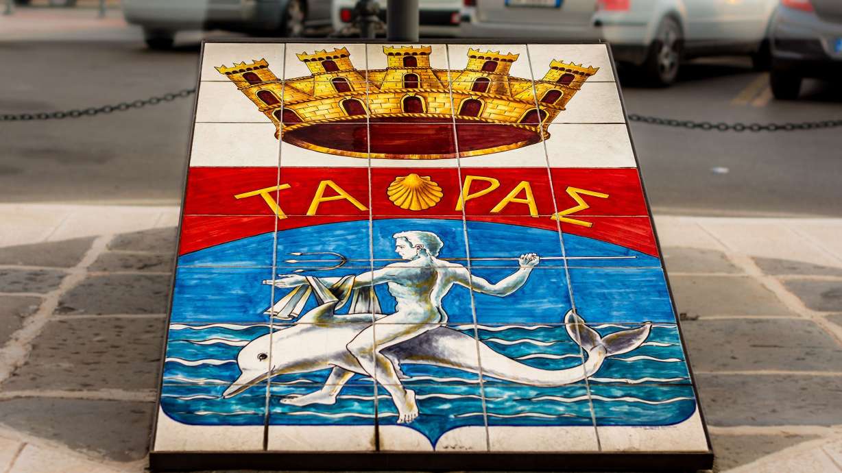 Taranto's coat of arms celebrates the legend of how the city's founder, Taras, was rescued by a dolphin.