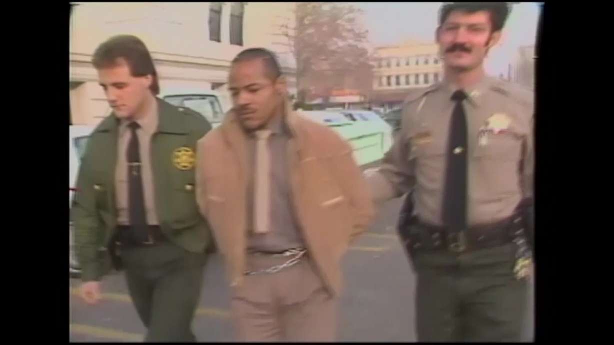 A screengrab shows a moment in a piece of archived footage from the day Douglas Carter was arrested.
