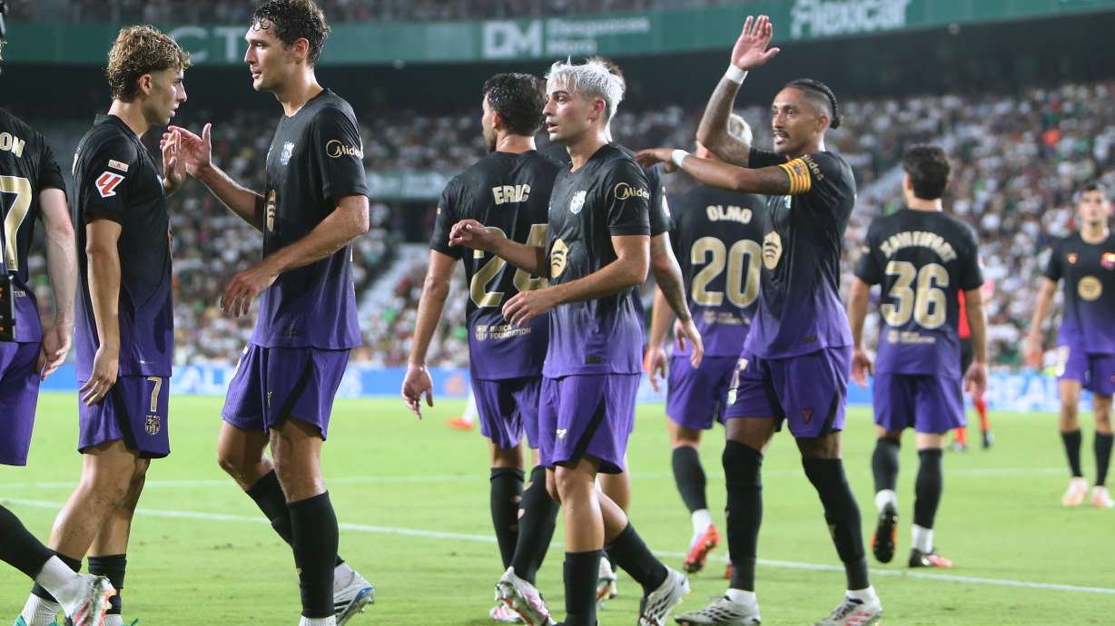 Barcelona's Fermin Lopez, left, celebrates after scoring his side's his fifth goal during a Spanish La Liga soccer match between Elche and Barcelona in Elche, Spain, Sunday, Aug. 23, 2026.
