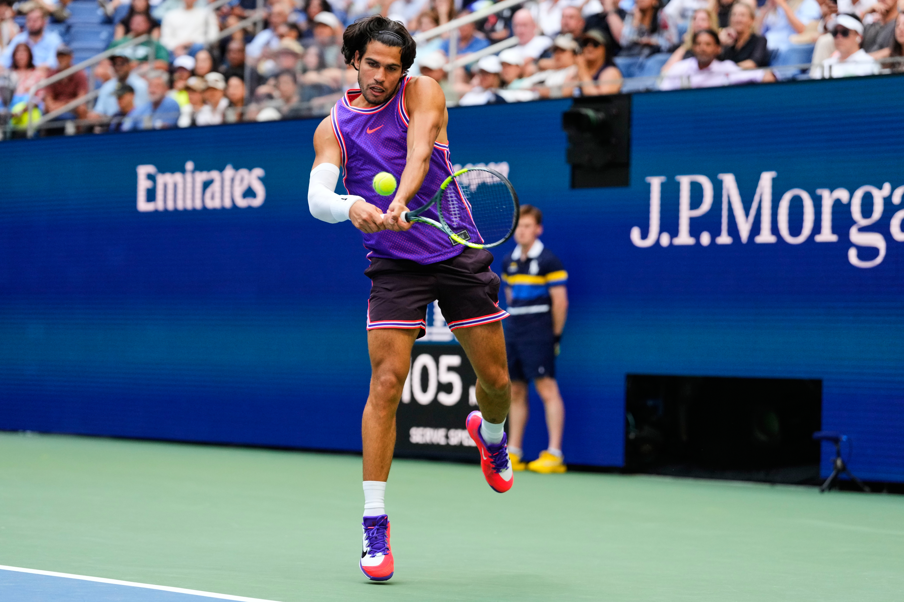 Carlos Alcaraz, of Spain, returns the ball during a mixed doubles match at the U.S. Open tennis championships, Tuesday, Aug. 25, 2026, in New York. 