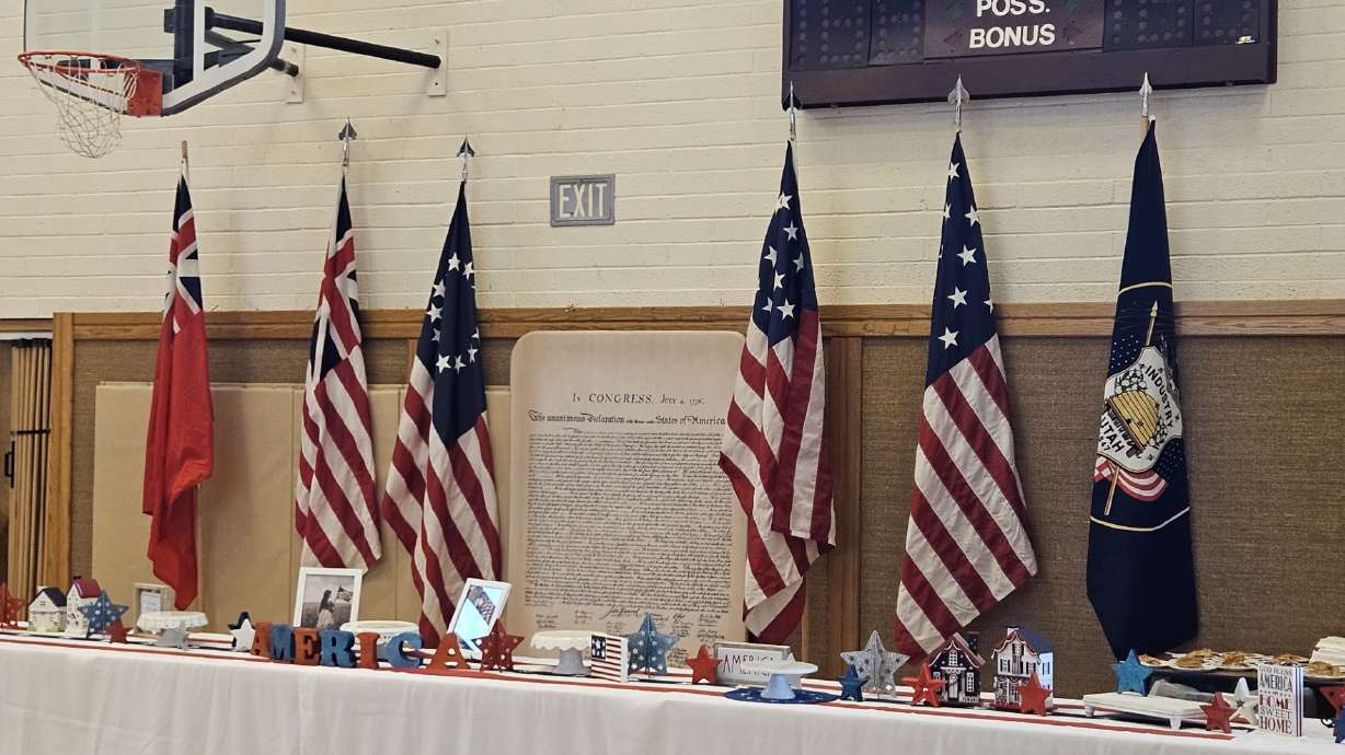 DeVaughn Simper showcased several of his historic American flags while at a speaking event in July of 2025.