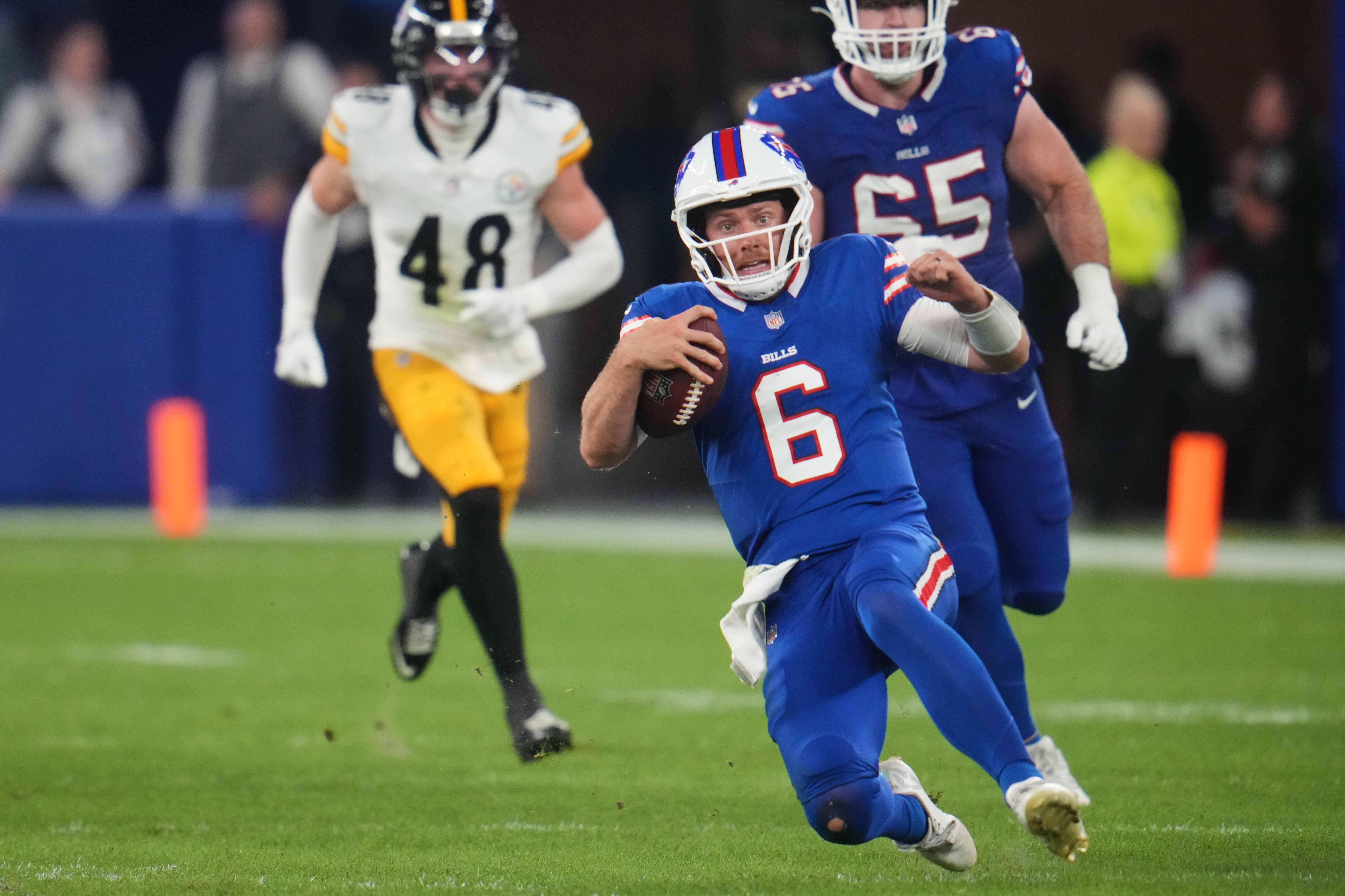 Buffalo Bills quarterback Shane Buechele (6) runs the ball for a short gain in the second half of a preseason NFL football game against the Pittsburgh Steelers in Orchard Park, NY., Thursday, Aug. 27, 2026.