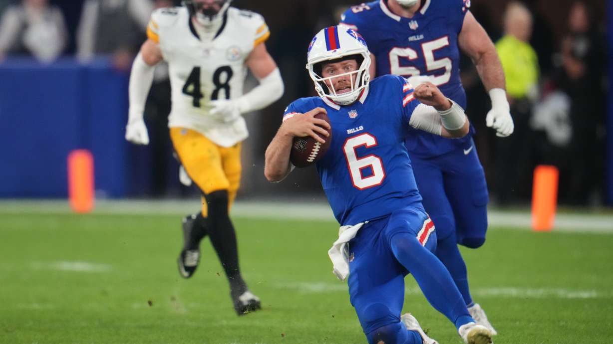Buffalo Bills quarterback Shane Buechele (6) runs the ball for a short gain in the second half of a preseason NFL football game against the Pittsburgh Steelers in Orchard Park, NY., Thursday, Aug. 27, 2026.