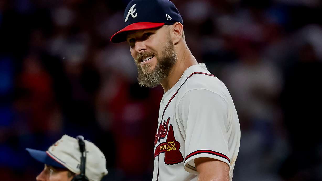Atlanta Braves pitcher Chris Sale, right, celebrates after winning a baseball game shutout against the Los Angeles Dodgers, Thursday, Aug. 27, 2026, in Atlanta.