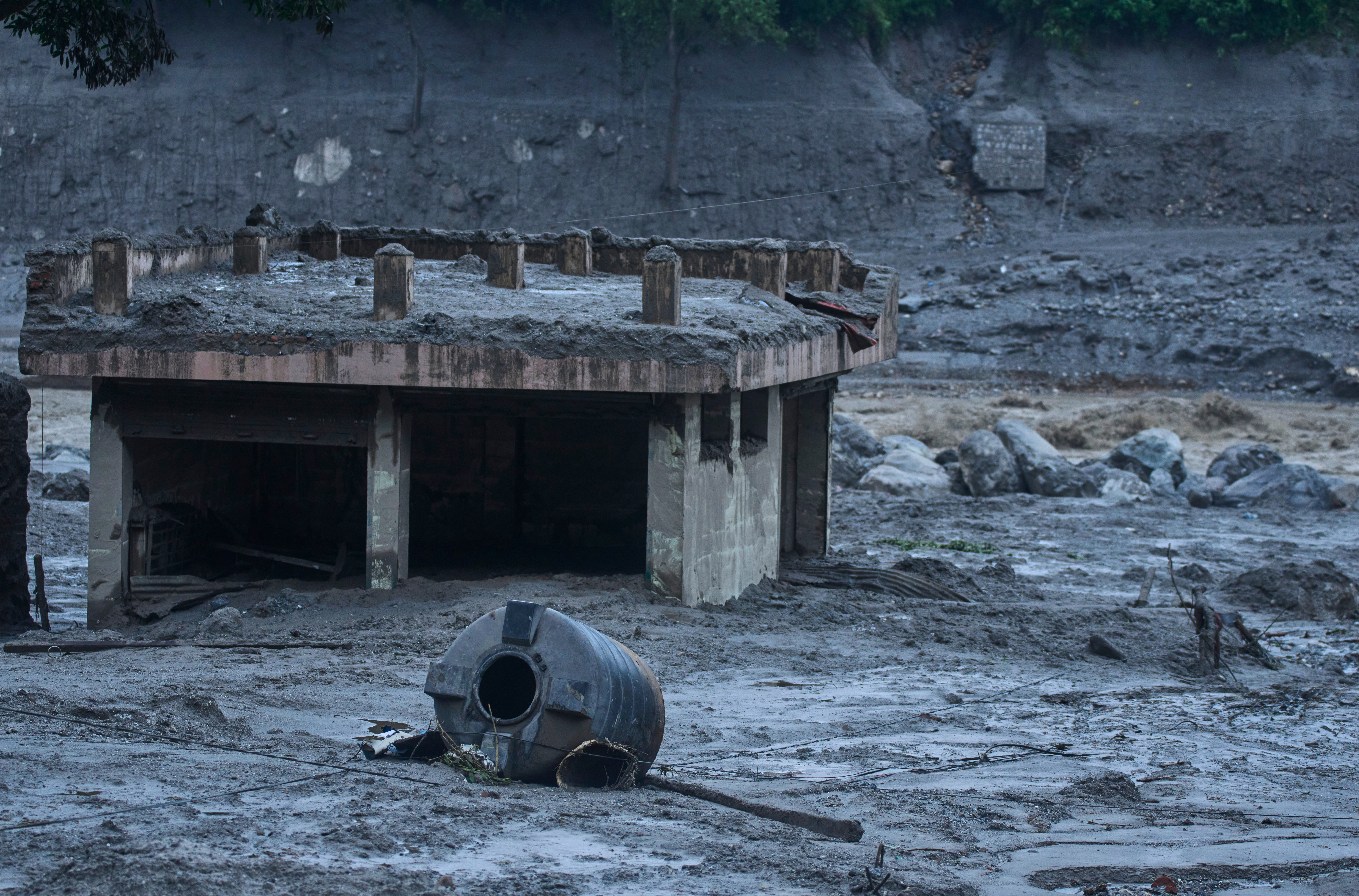 Damage is seen in the aftermath of flash floods in Devighat in the Nuwakot district in Nepal, Thursday, Aug. 27, 2026. 