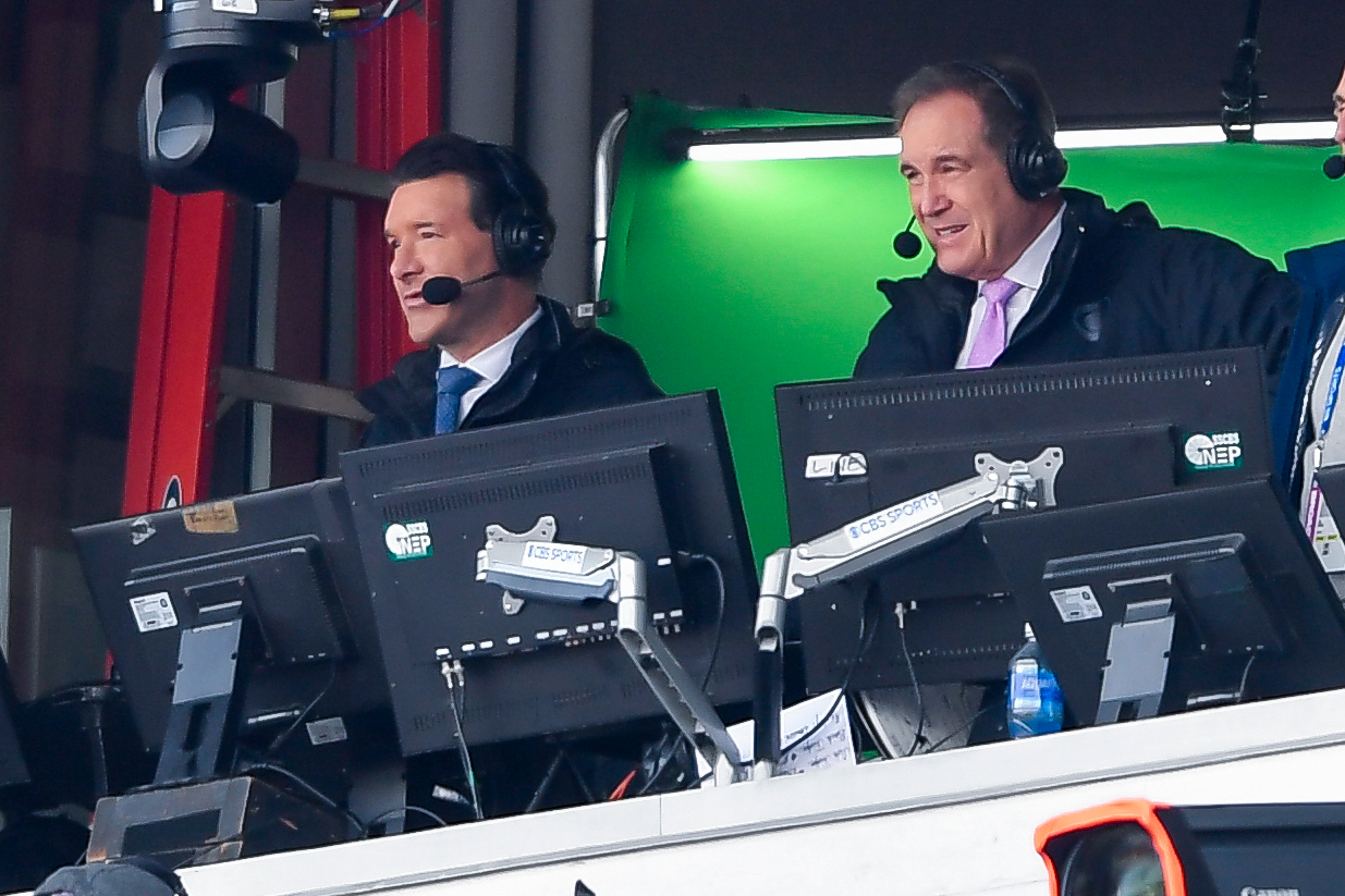 FILE - CBS broadcaster Tony Romo, left, calls the game during the second half of a NFL football wild card playoff game between the Buffalo Bills and the Denver Broncos in Orchard Park, N.Y., Jan. 12, 2025. 