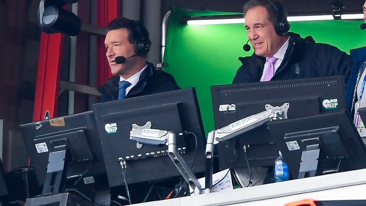 FILE - CBS broadcaster Tony Romo, left, calls the game during the second half of a NFL football wild card playoff game between the Buffalo Bills and the Denver Broncos in Orchard Park, N.Y., Jan. 12, 2025.