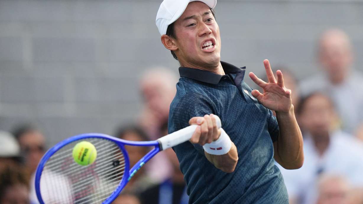 Kei Nishikori, of Japan, returns the ball to Michael Antonius, of the United States, during a qualifying match at the U.S. Open tennis championships Wednesday, Aug. 26, 2026, in New York.