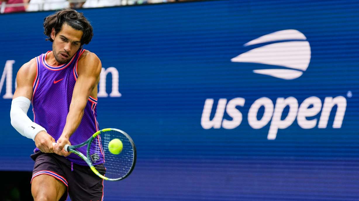 Carlos Alcaraz, of Spain, returns the ball during a mixed doubles match at the U.S. Open tennis championships, Tuesday, Aug. 25, 2026, in New York.