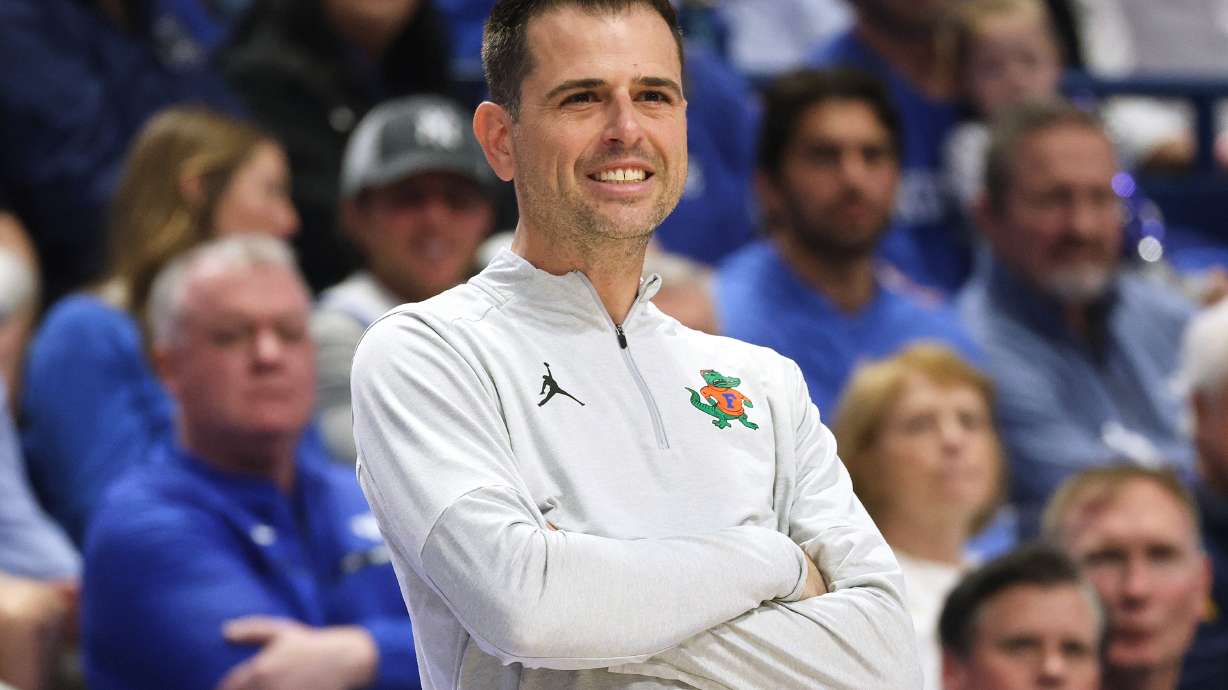 FILE - Florida head coach Todd Golden smiles during the second half of an NCAA college basketball game against Kentucky in Lexington, Ky., March 7, 2026.