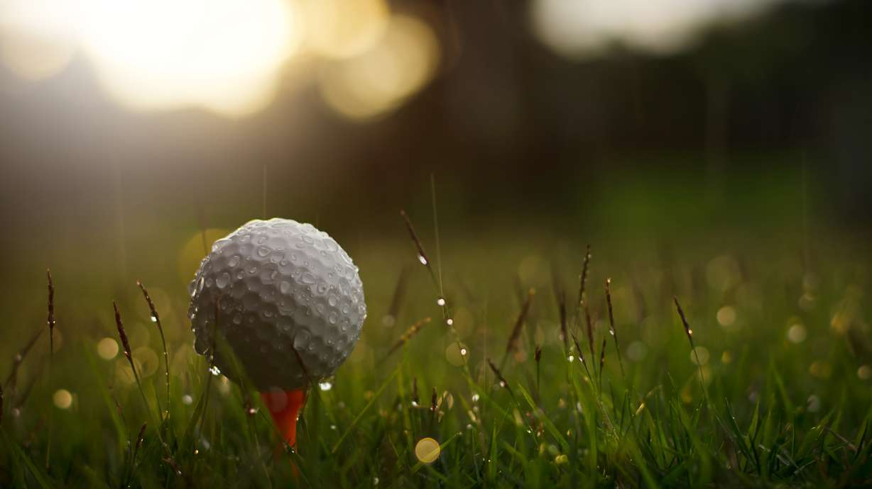 A golfer who had taken shelter from the rain was struck by lighting while recording his friends pushing a golf cart out of the mud.