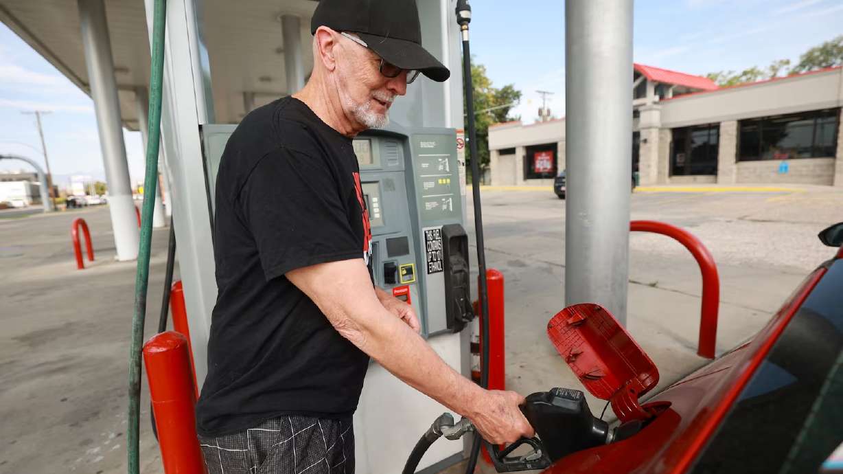 Steven Whittaker gets gas at Shoppers Express in Salt Lake City on Aug. 11. Average gas prices have surged to $5 per gallon or more in parts of Utah, AAA reports.