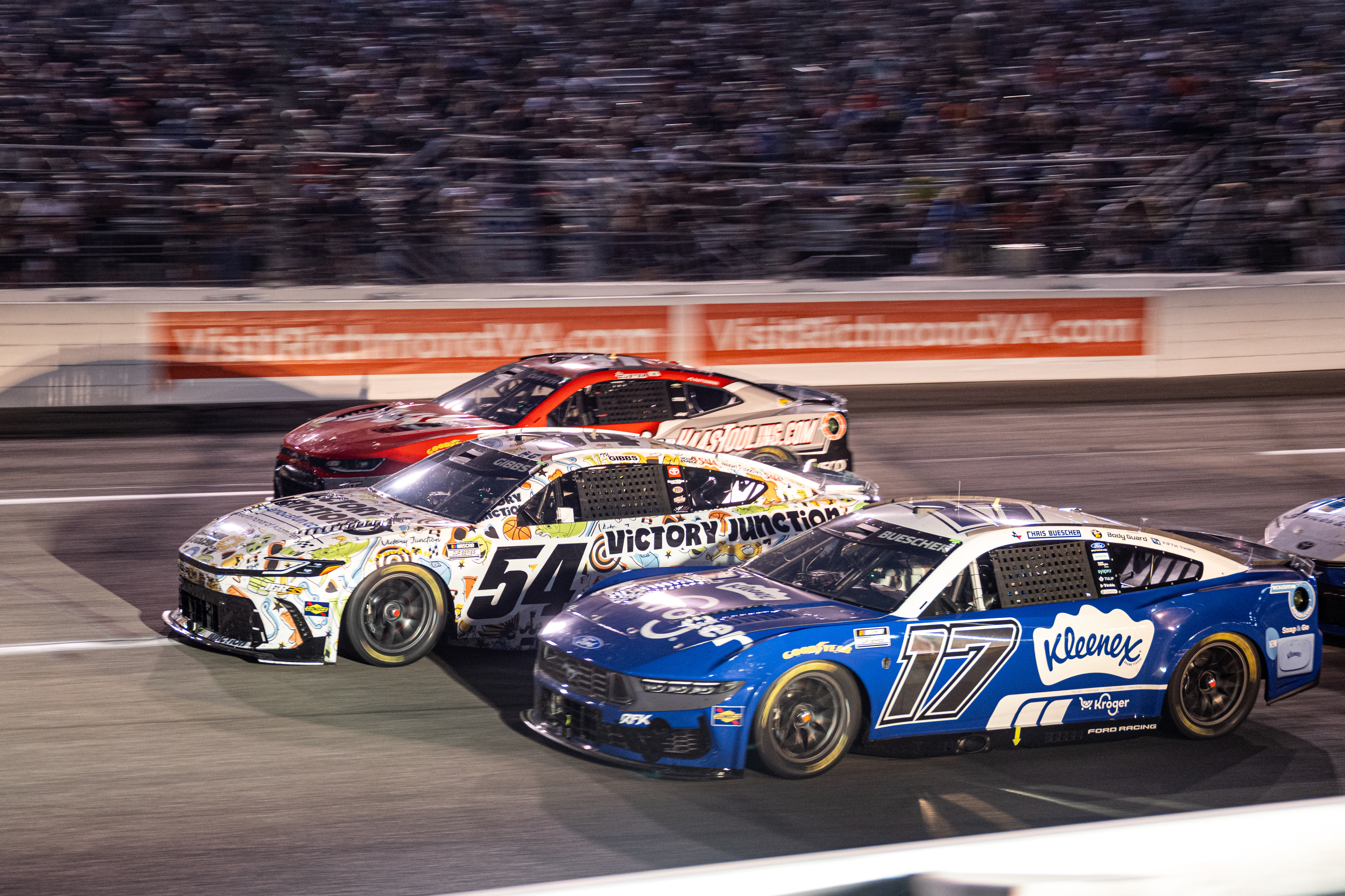 Roush Fenway Keselowski Racing driver Chris Buescher (17) and Joe Gibbs Racing driver Ty Gibbs (54) battle in turn one during Cook Out 400 at Richmond Raceway, Saturday, Aug. 15, 2026, in Richmond Va. 