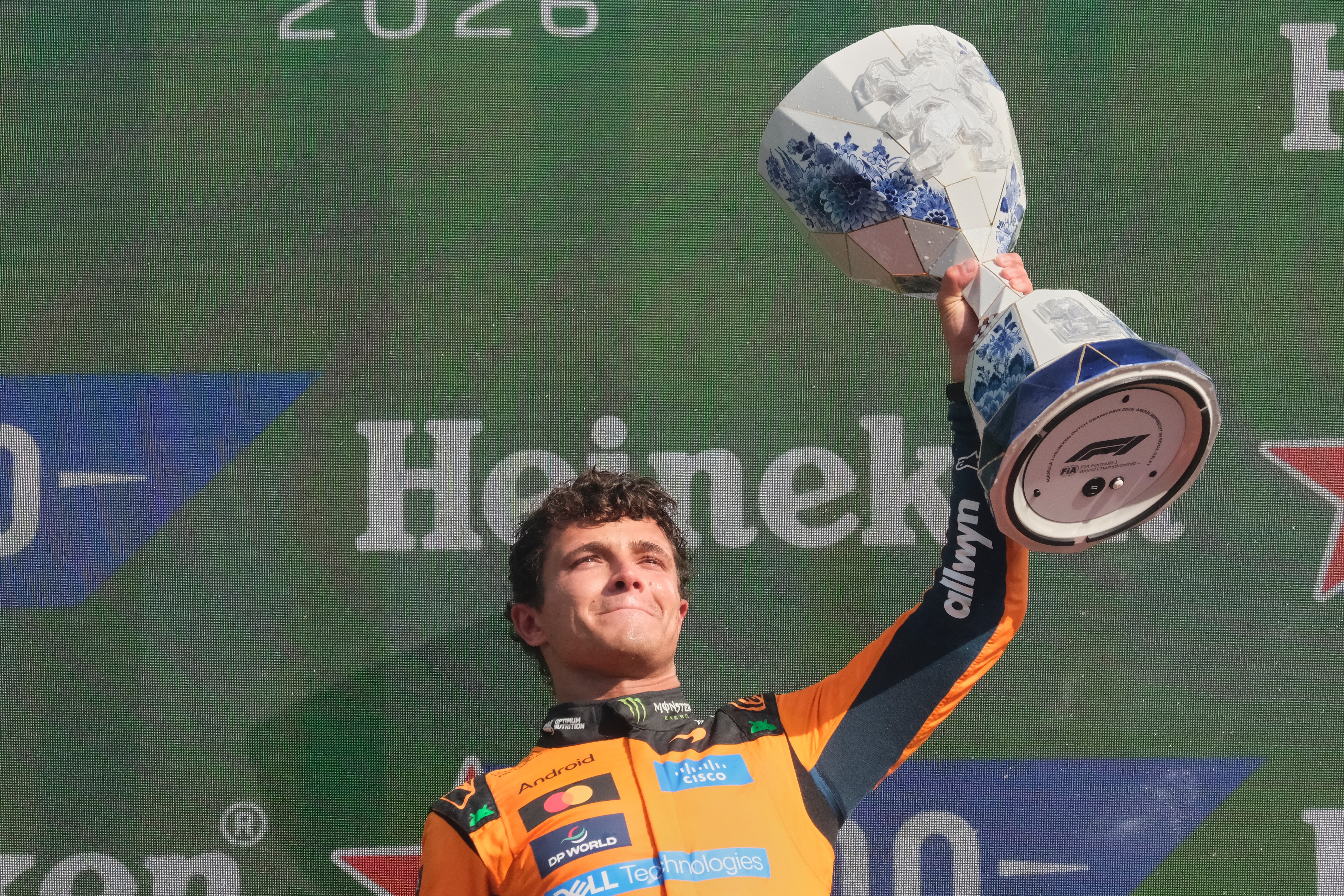 McLaren driver Lando Norris of Britain holds the trophy after winning the Formula One Dutch Grand Prix in Zandvoort , Netherlands, Sunday, Aug. 23, 2026. 