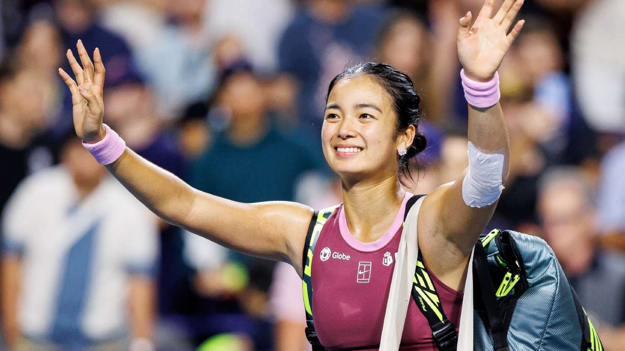 Alexandra Eala, of the Philippines, waves to the crowd after losing to Belinda Bencic, of Switzerland, in a round of 16 match at the National Bank Open tennis tournament in Toronto, on Sunday, Aug. 9, 2026.