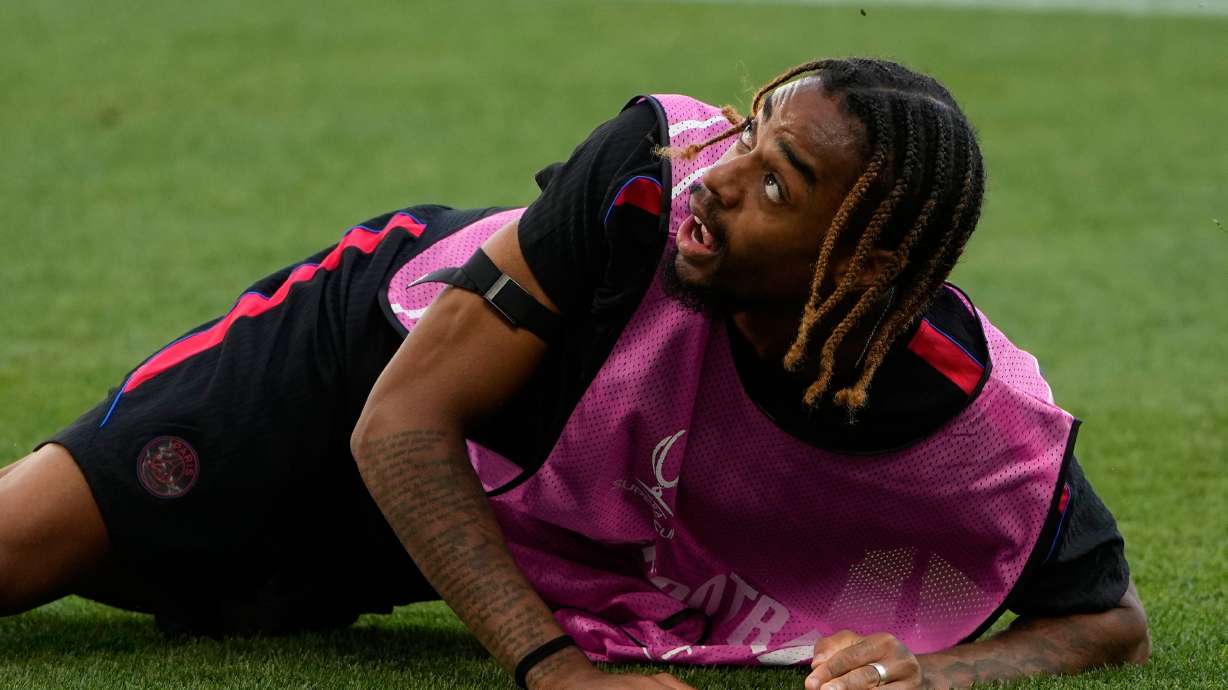 PSG's Bradley Barcola eyes the ball during a training session ahead of the UEFA Super Cup soccer match against Aston Villa in Salzburg, Austria, Tuesday, Aug. 11, 2026.