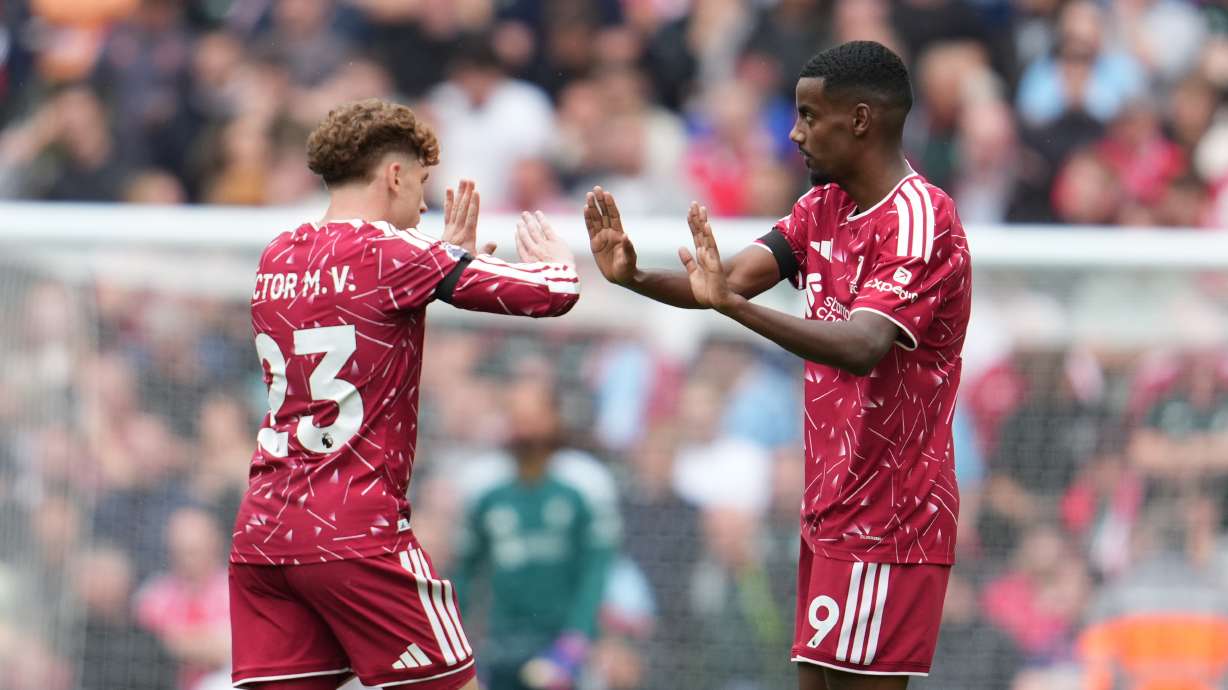 Liverpool's Alexander Isak, right, celebrates with Liverpool's Victor Munoz after scoring his side's opening goal during the English Premier League soccer match between Liverpool and Nottingham Forest in Liverpool, England, Saturday, Aug. 29, 2026.