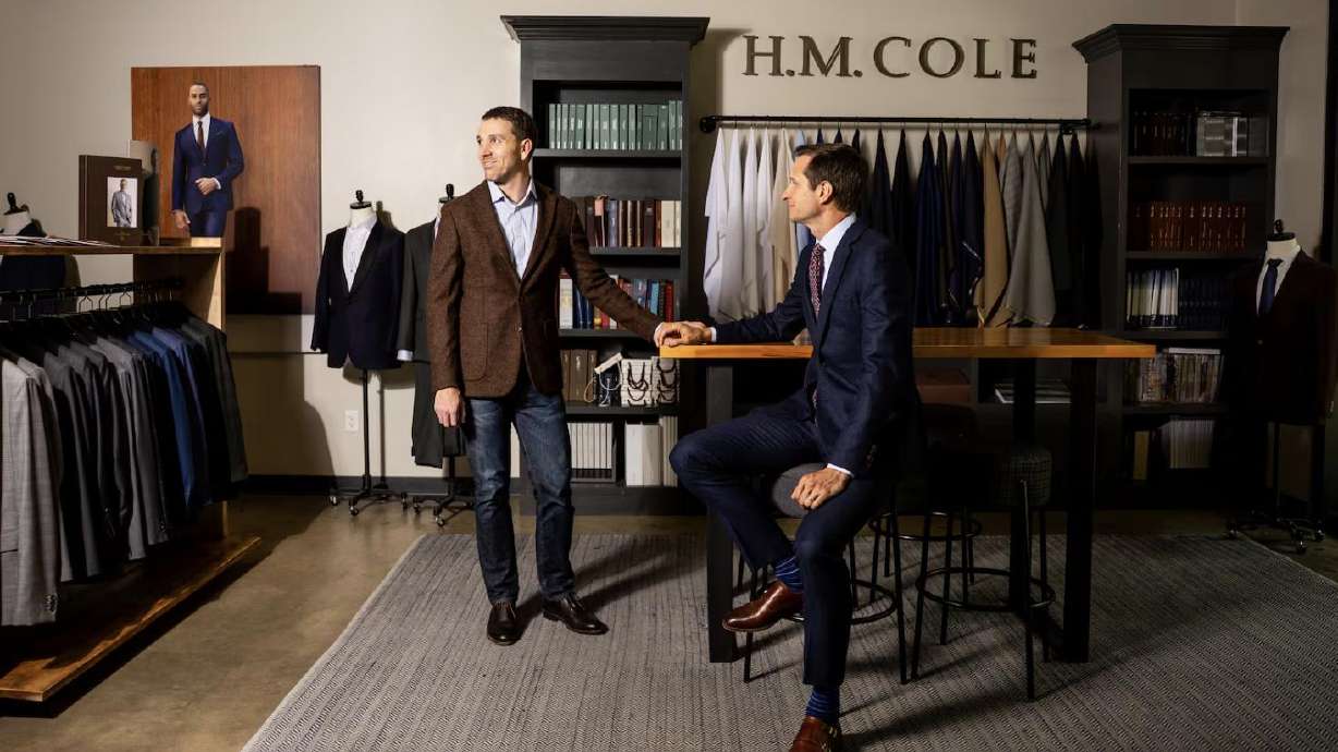 Hayden Bryant, left, and Daniel McConkie, right, co-founders and co-owners of H.M. Cole Custom Suits, pose at H.M. Cole Custom Suits in Salt Lake City on Aug. 6.