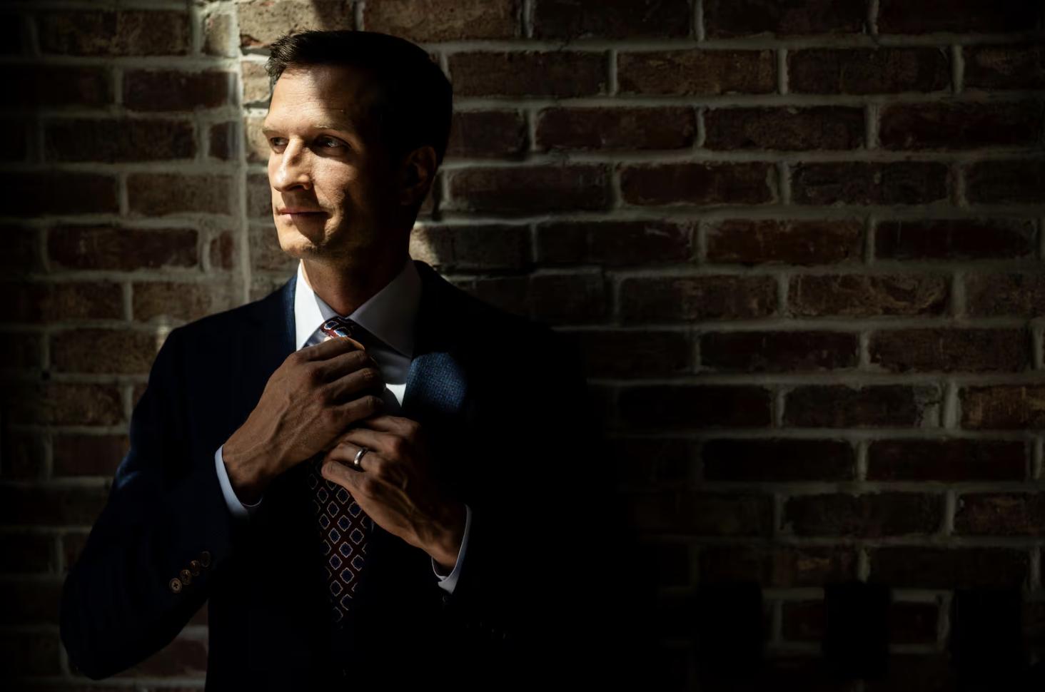 Daniel McConkie, co-founder and co-owner of H.M. Cole Custom Suits, poses at H.M. Cole Custom Suits in Salt Lake City on Aug. 6.