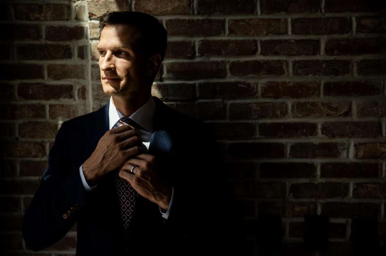Daniel McConkie, co-founder and co-owner of H.M. Cole Custom Suits, poses at H.M. Cole Custom Suits in Salt Lake City on Aug. 6.
