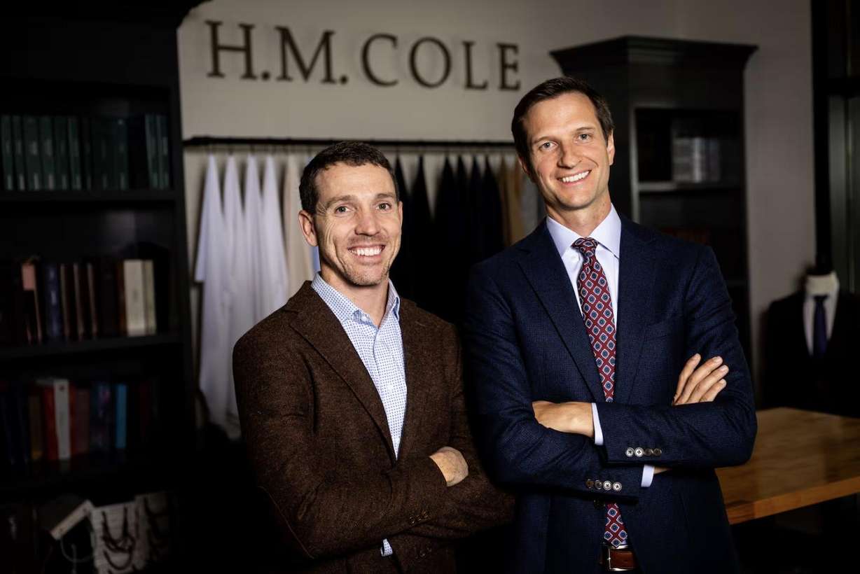 Hayden Bryant, left, and Daniel McConkie, right, co-founders and co-owners of H.M. Cole Custom Suits, pose at H.M. Cole Custom Suits in Salt Lake City on Aug. 6.