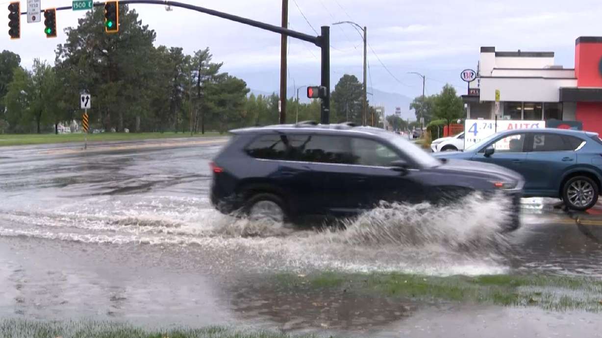 Video footage captured in Salt Lake City on Aug. 29 shows cars plowing through a large puddle of water at the intersection of 2100 S. 1500 East near Sugar House Park.