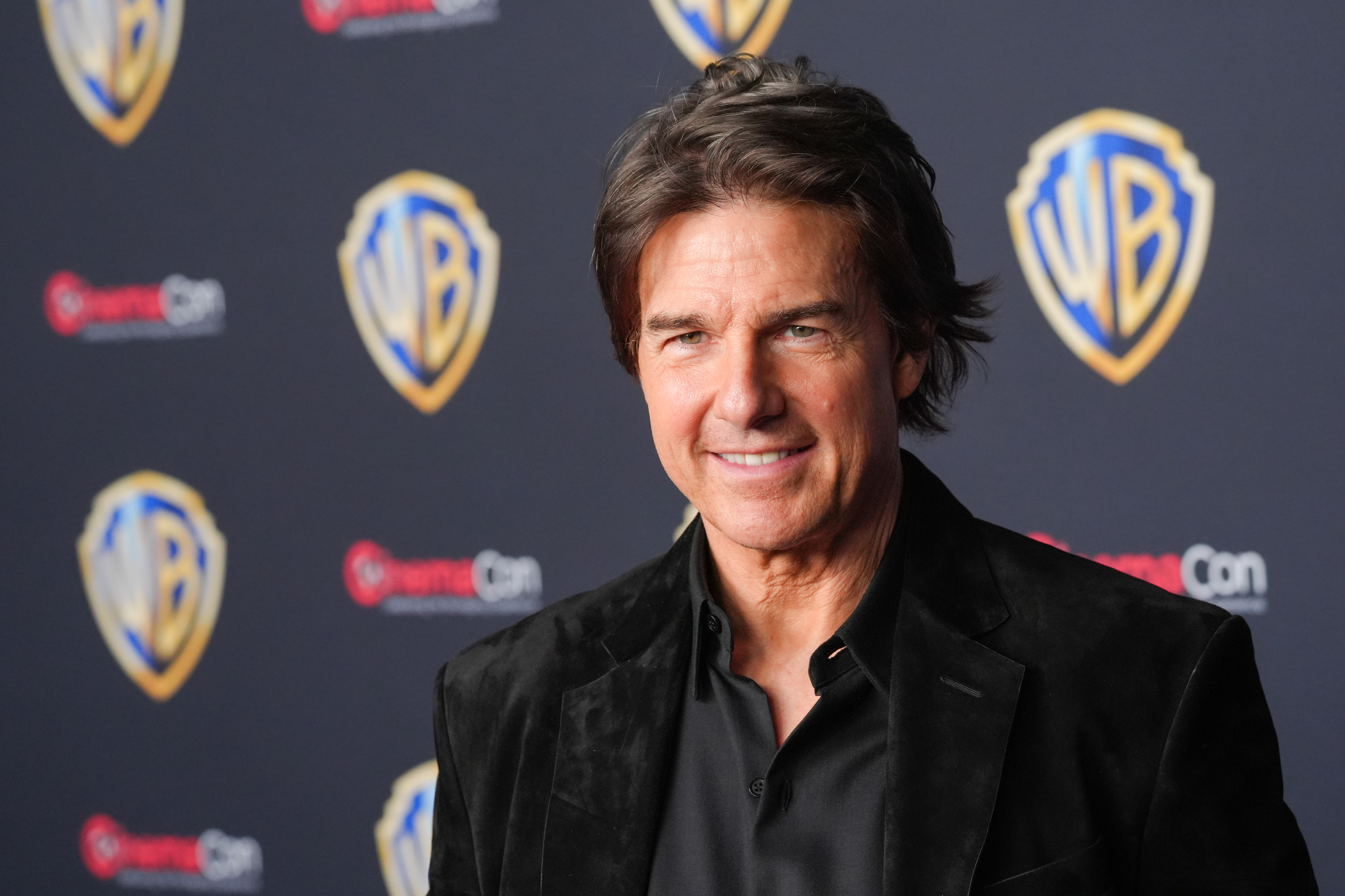 FILE - Tom Cruise arrives at the Warner Bros. presentation at CinemaCon on April 14, 2026, at Caesars Palace in Las Vegas. 
