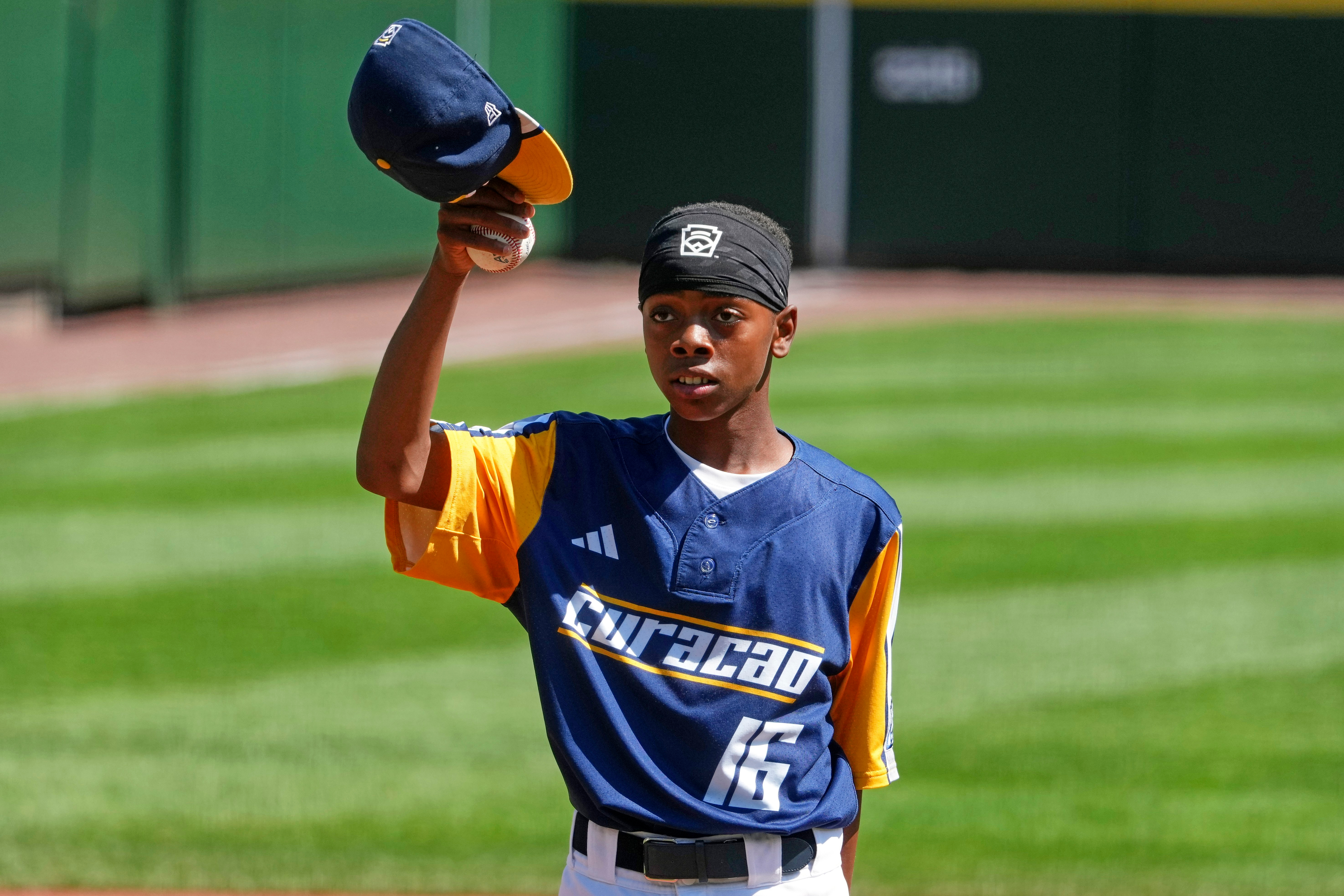 Curacao's Jaymiell Martina (16) tips his cap after reaching his pitch count limit during the sixth inning of the International Championship baseball game Japan at the Little League World Series tournament in South Williamsport, Pa., Saturday, Aug. 29, 2026. 