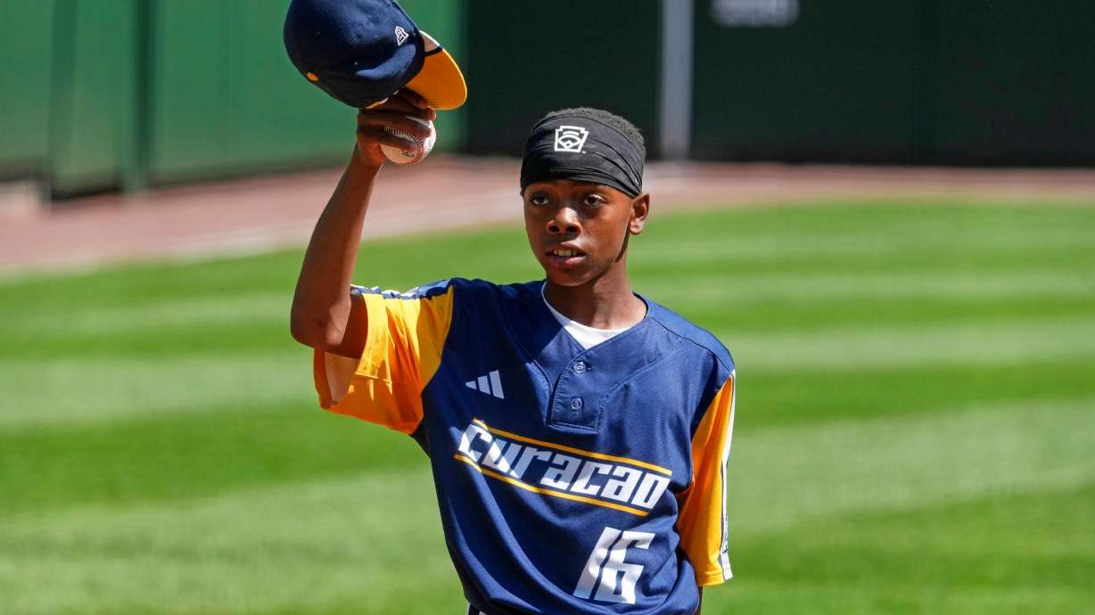 Curacao's Jaymiell Martina (16) tips his cap after reaching his pitch count limit during the sixth inning of the International Championship baseball game Japan at the Little League World Series tournament in South Williamsport, Pa., Saturday, Aug. 29, 2026.