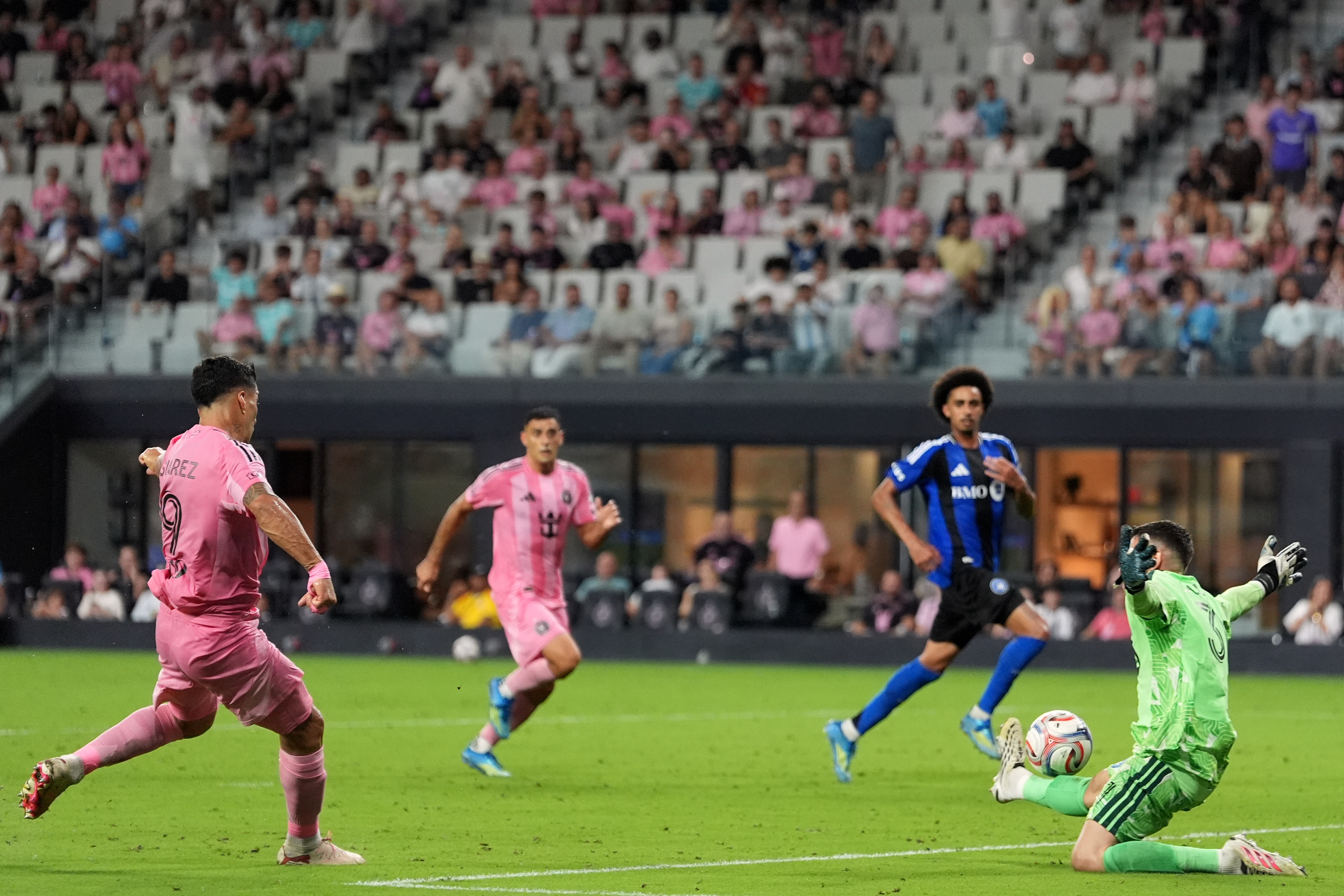 Inter Miami forward Luis Suarez scores his side's fourth goal past CF Montreal goalkeeper Thomas Gillier (31) during the second half of an MLS soccer match, Saturday, Aug. 29, 2026, in Miami. 