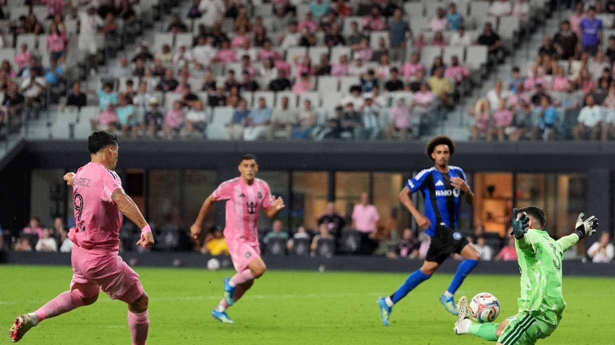 Inter Miami forward Luis Suarez scores his side's fourth goal past CF Montreal goalkeeper Thomas Gillier (31) during the second half of an MLS soccer match, Saturday, Aug. 29, 2026, in Miami.